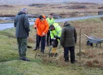 Digging the hole for the otter crossing road sign Kinloch, Isle of Mull